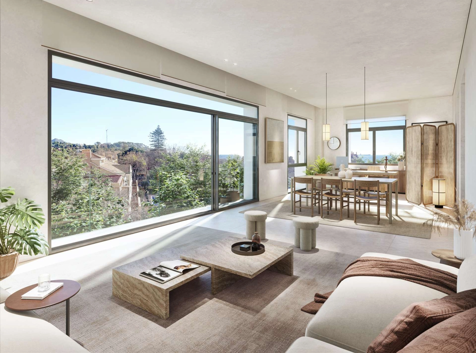 Grote ramen vullen de woonruimtes met natuurlijk licht en verbinden de interieurs met de prachtige omgeving.
