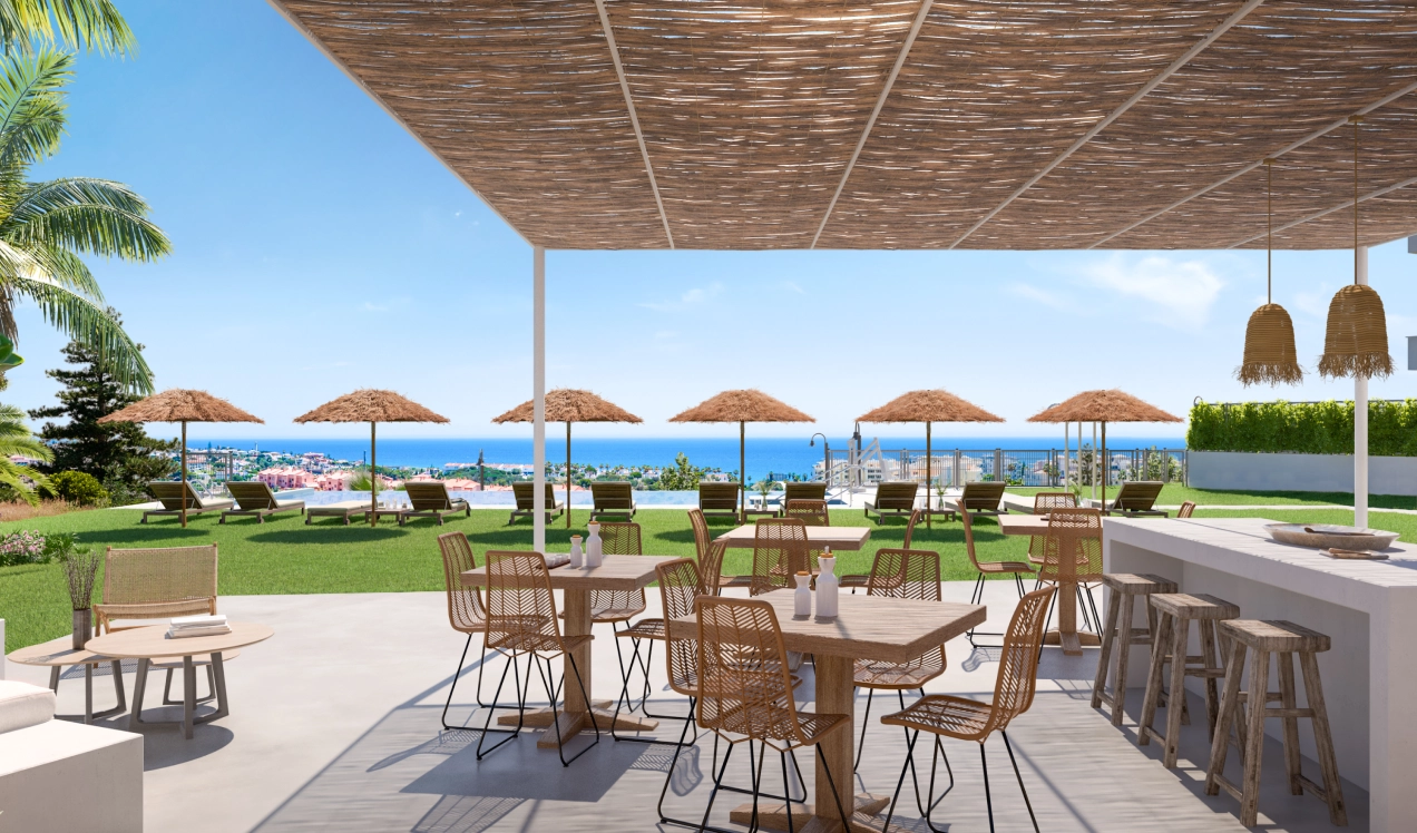 Het uitnodigende gemeenschappelijke zwembad en zonneterras, een perfecte plek om te ontspannen met uitzicht op de kust.