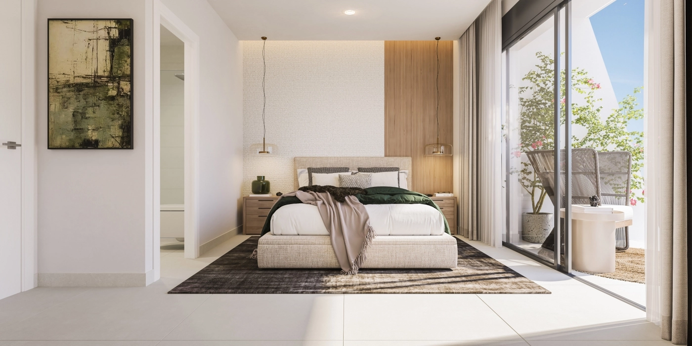 De hoofdslaapkamer is een rustig toevluchtsoord, gevuld met natuurlijk licht en biedt directe toegang tot een buitenterras.