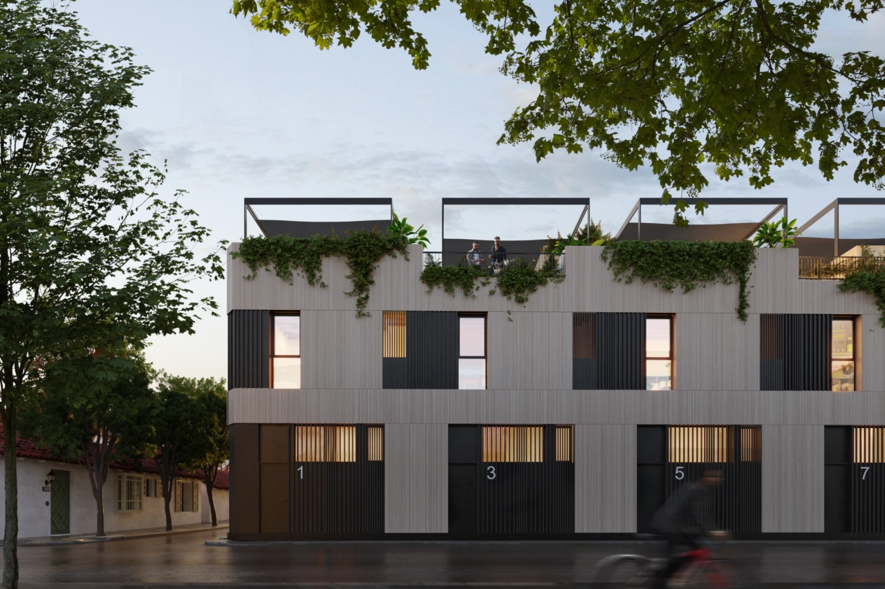 Een avondzicht op het complex, dat de warme verlichting en elegante architectuur toont.