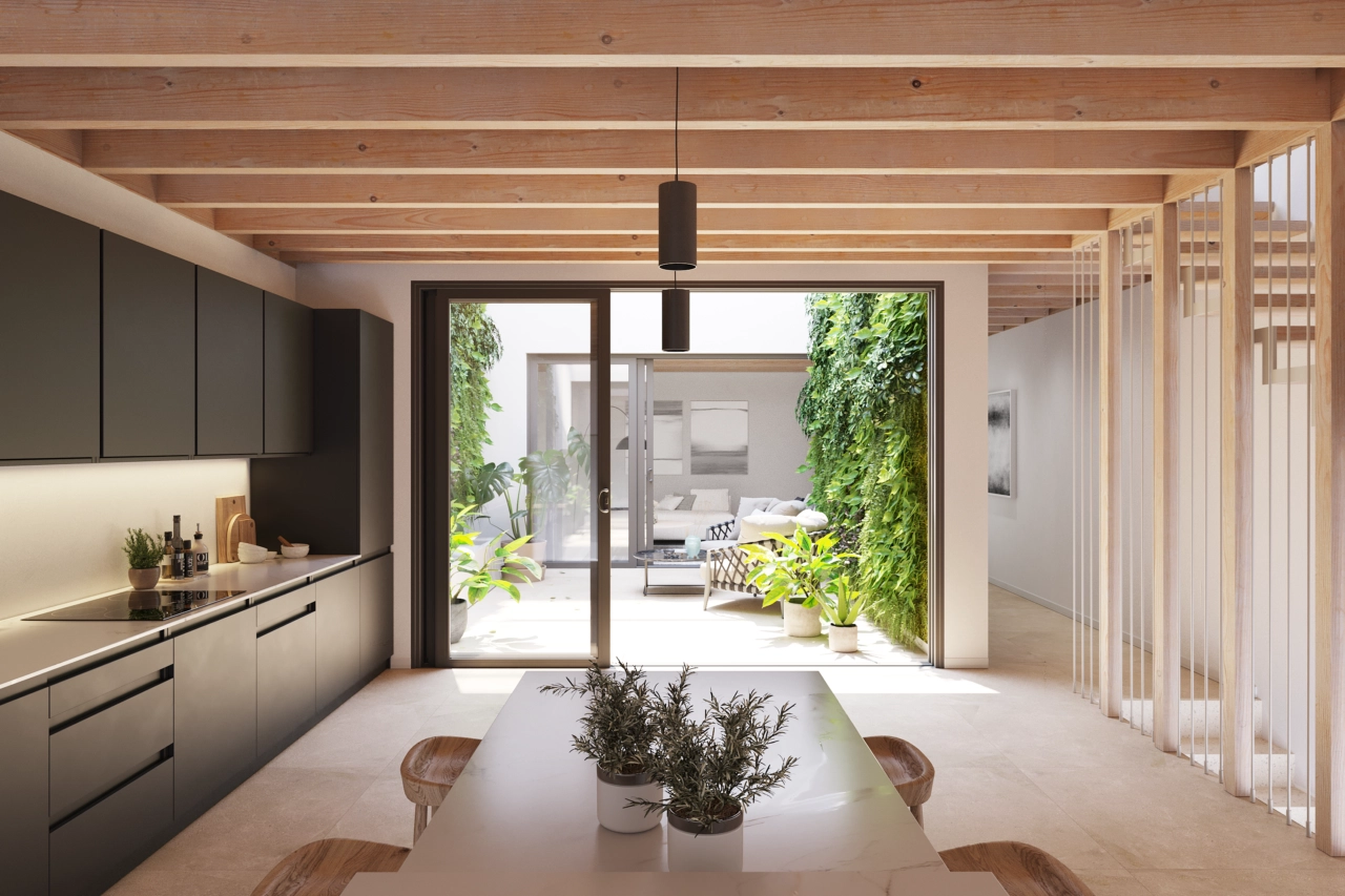 De moderne keuken is ontworpen voor functionaliteit en komt uit op de centrale patio.