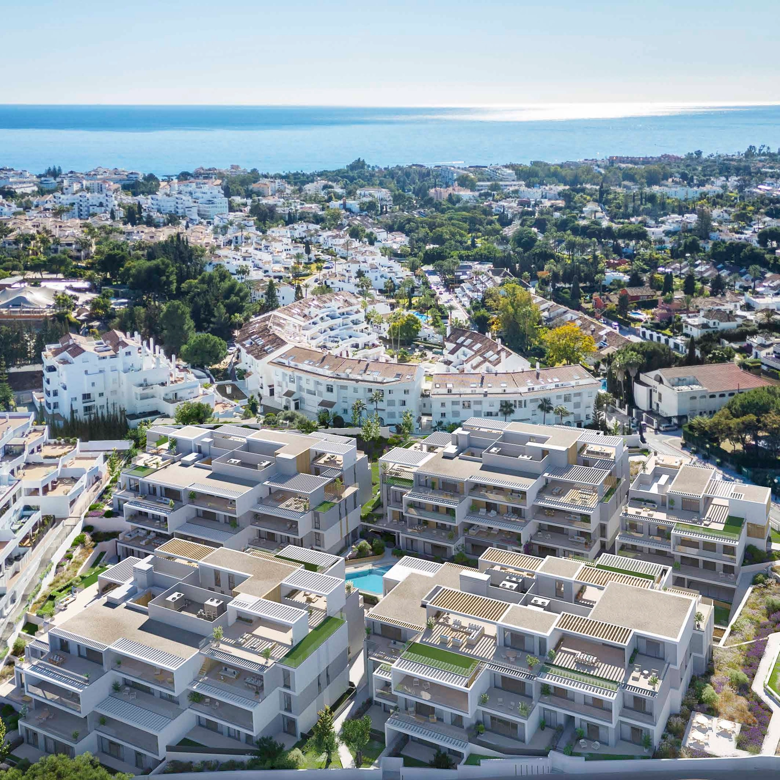 Een luchtfoto van het Isla Bela project, dat het moderne ontwerp en de nabijheid van de Middellandse Zee toont.