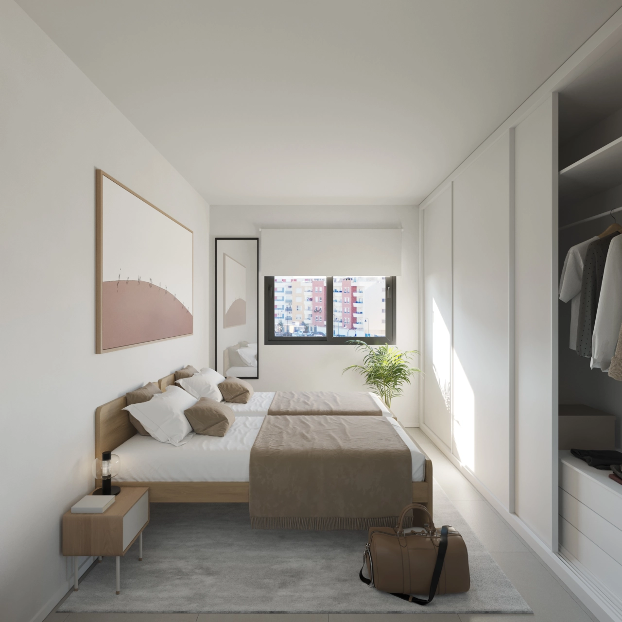 Een comfortabele en lichte tweede slaapkamer met ruime opbergmogelijkheden.