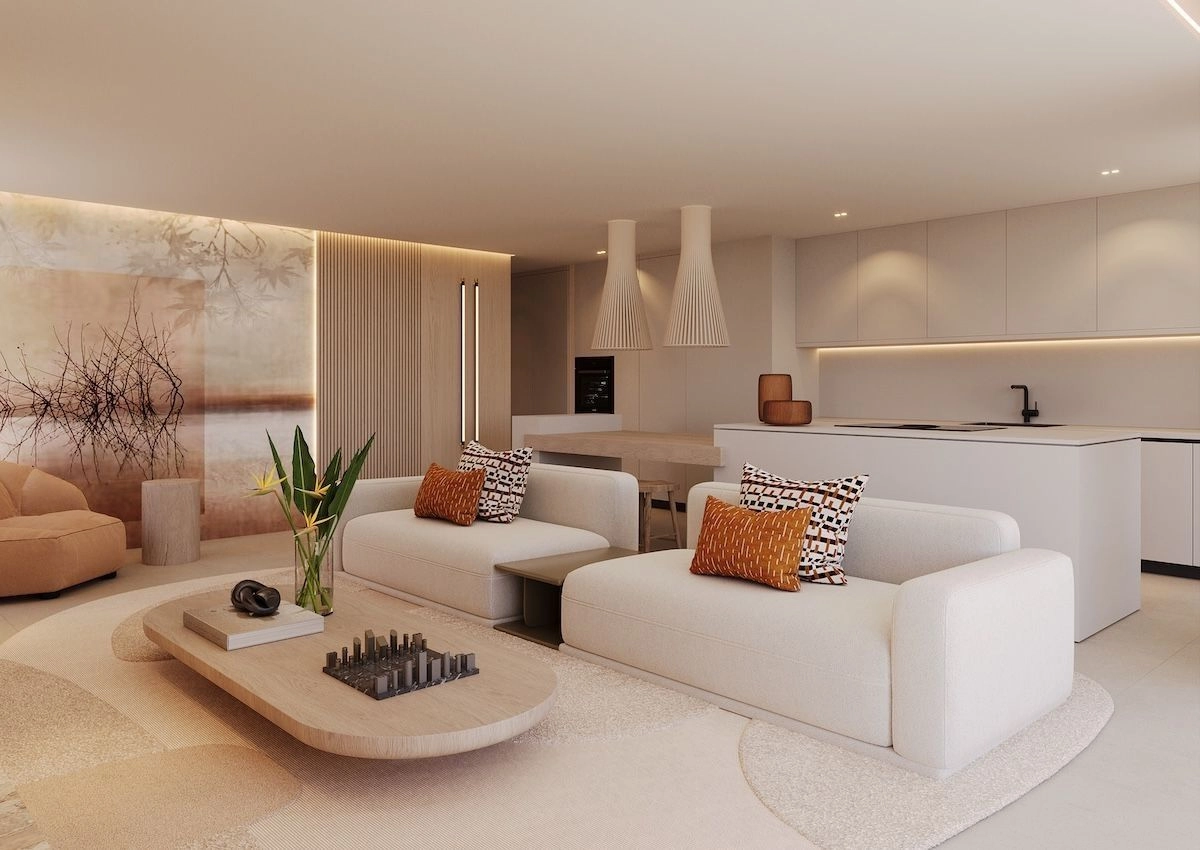 Een strakke, moderne keuken, uitgerust met hoogwaardige apparatuur en naadloos geïntegreerd in de woon- en eetgedeeltes.