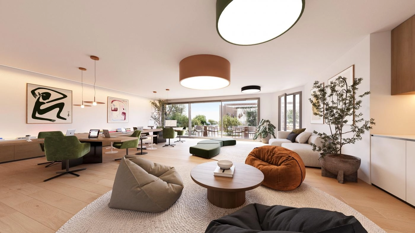 Een veelzijdige en stijlvolle co-working- en sociale lounge waar bewoners comfortabel kunnen werken, ontmoeten of ontspannen.