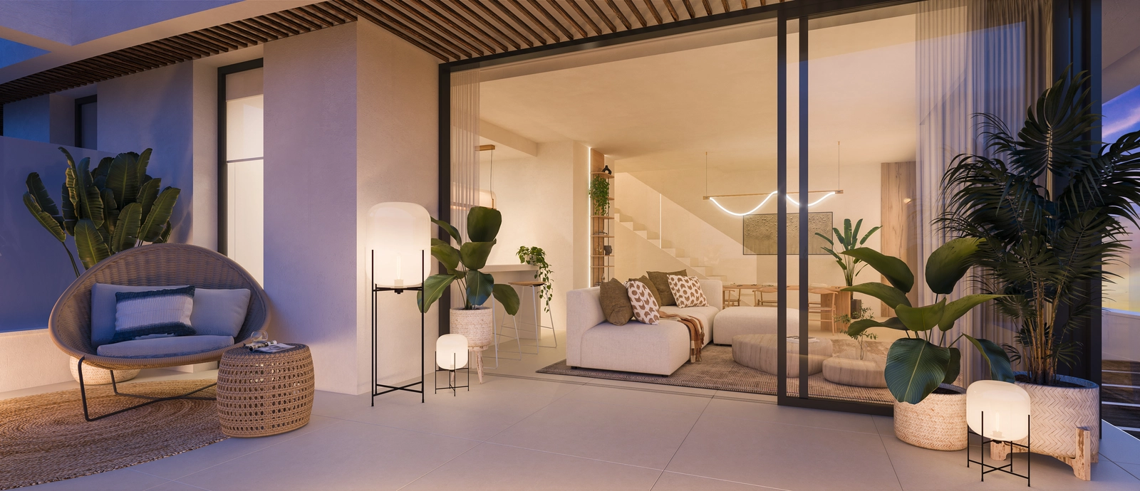 Een elegante woonruimte die opent naar een ruim terras voor een naadloze overgang tussen binnen- en buitenleven.