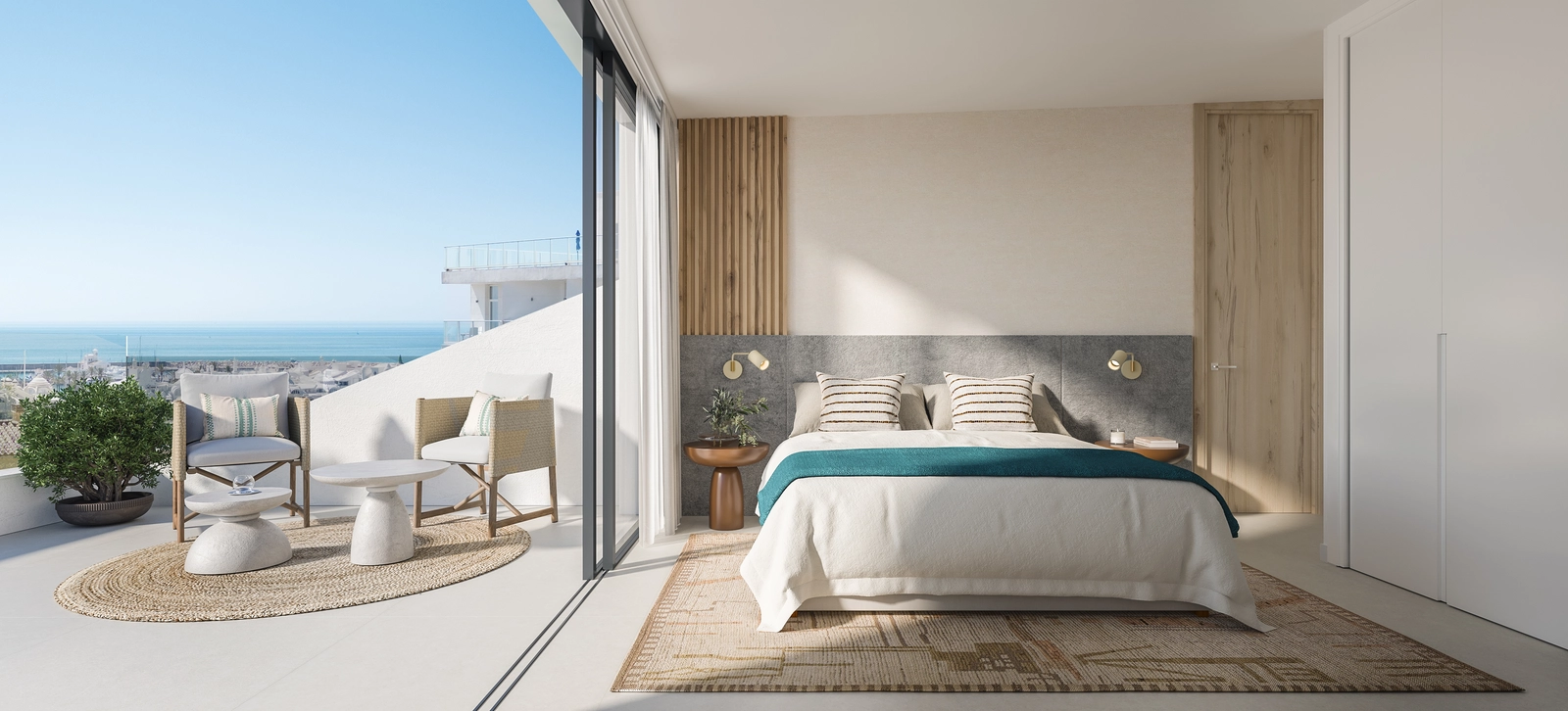 Een lichte en serene slaapkamer met directe toegang tot een terras met prachtig uitzicht op zee.