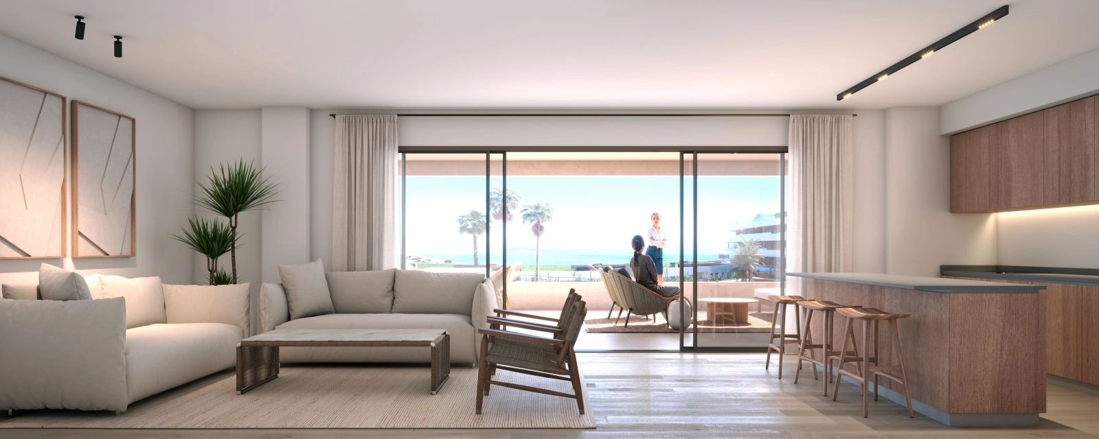 Een lichte en elegante woonkamer die direct toegang geeft tot een privéterras met uitzicht op zee.