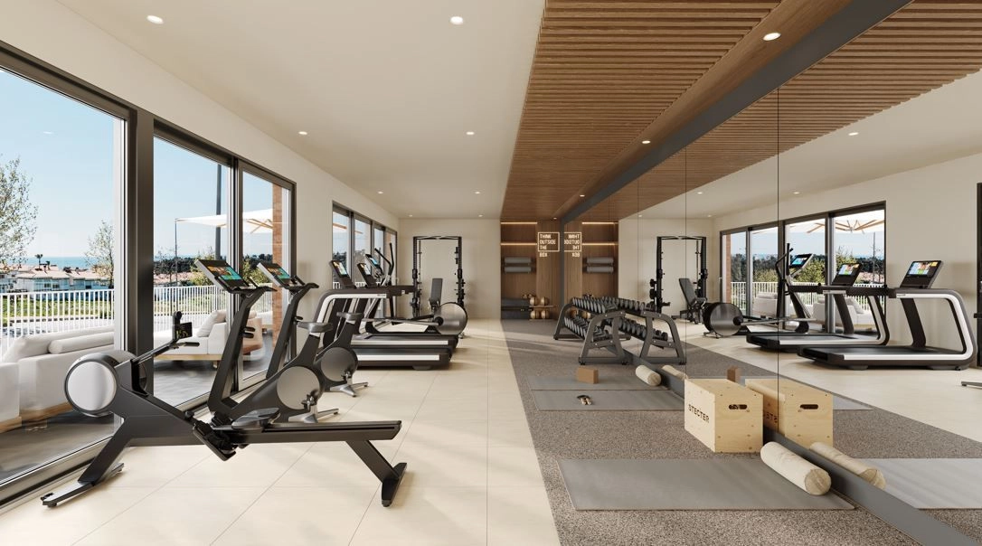 Een ultramoderne fitnessruimte met moderne apparatuur om een gezonde en actieve levensstijl te ondersteunen.