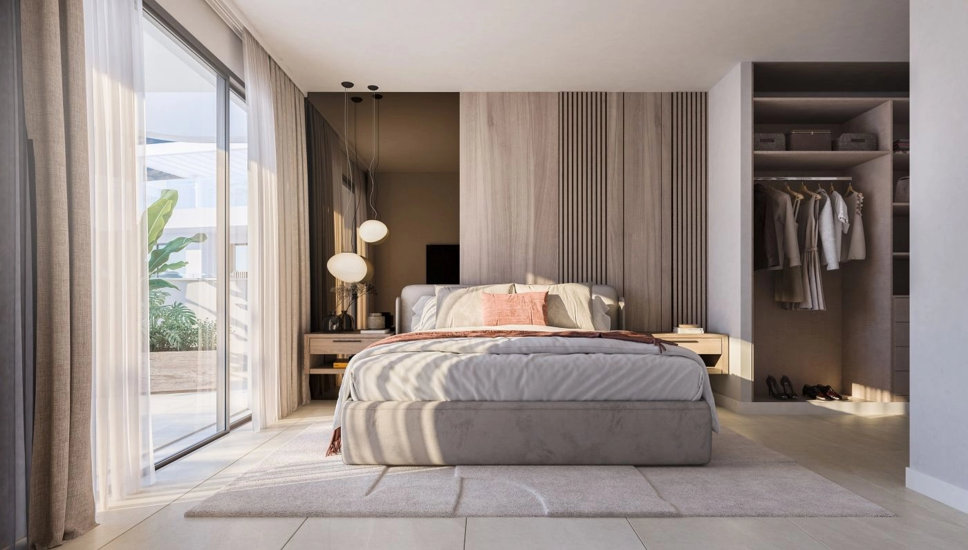 Een serene hoofdslaapkamer met een elegant ontwerp, veel opbergruimte en directe toegang tot een privé terras.
