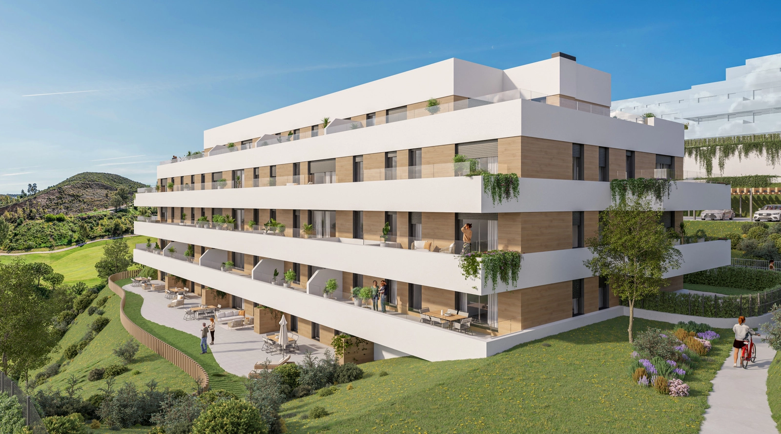 De moderne architectuur van de residenties, met uitzicht op het weelderig groene landschap van de golfbaan.