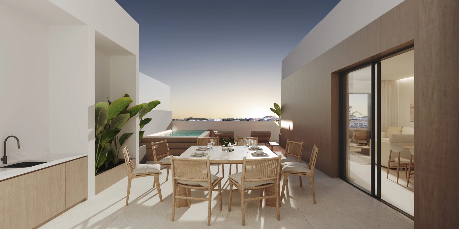 Geniet van avondmaaltijden met een prachtig uitzicht op de zonsondergang vanaf het solarium van het penthouse.