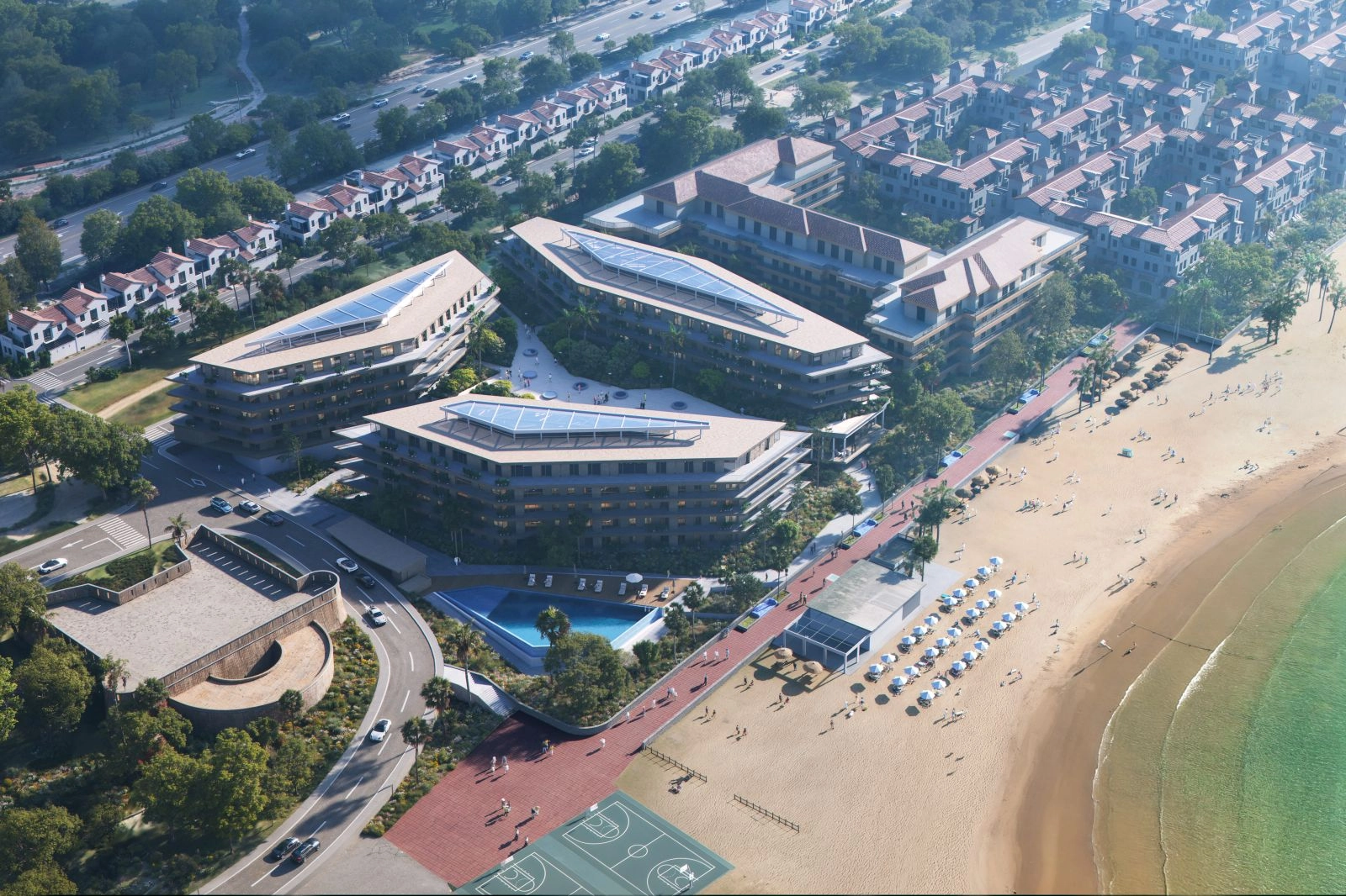 Een luchtfoto die de toplocatie aan het strand en de moderne architectuur van het project toont.