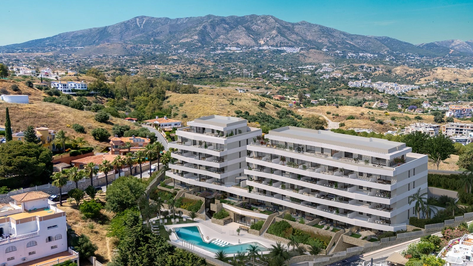 Een luchtfoto van het project, gelegen in de heuvels van Mijas met de bergen als een prachtig decor.