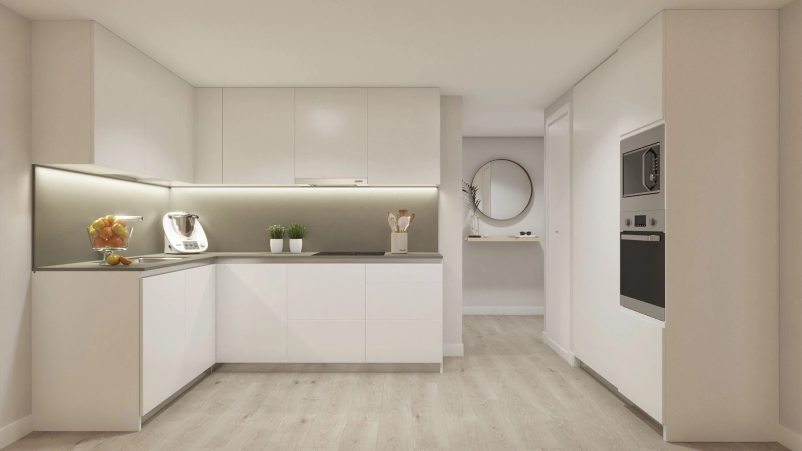 De moderne, open keuken is volledig uitgerust en ontworpen met strakke lijnen en hoogwaardige afwerkingen.