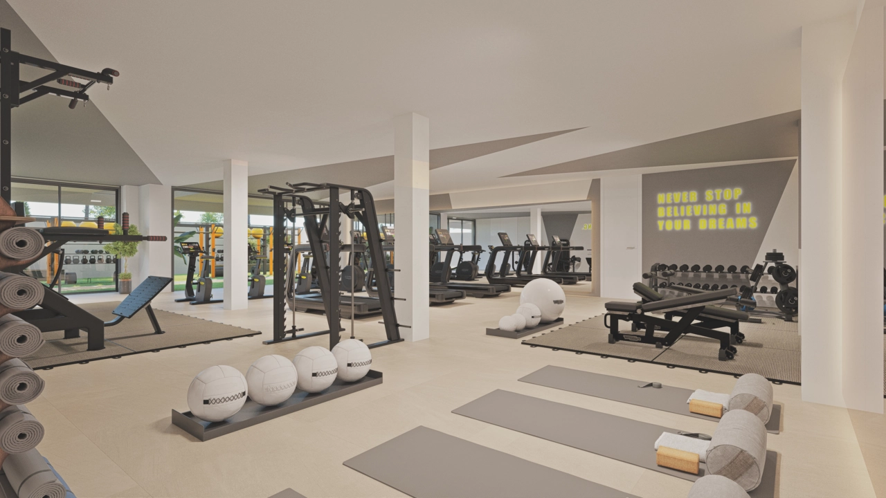 Een ultramoderne fitnessruimte met een breed scala aan apparatuur om een actieve en gezonde levensstijl te ondersteunen.