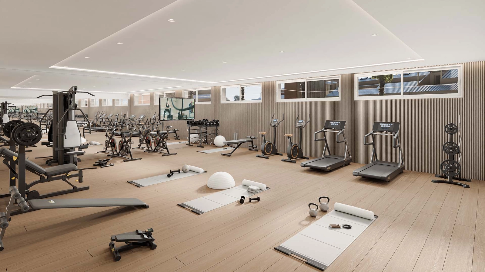 Een volledig uitgeruste, ultramoderne fitnessruimte voor de conditie en het welzijn van de bewoners.