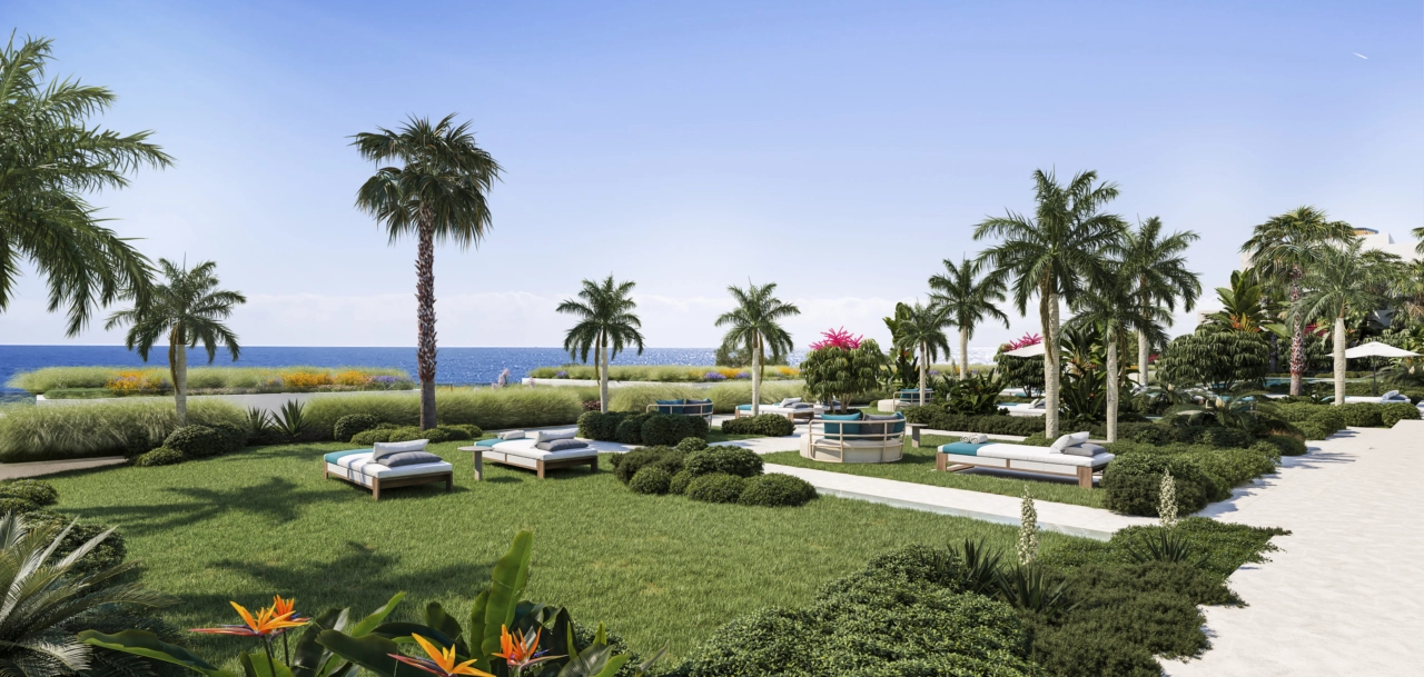 Weelderige gemeenschappelijke tuinen bieden een vredige oase voor bewoners, met directe toegang tot het strand.