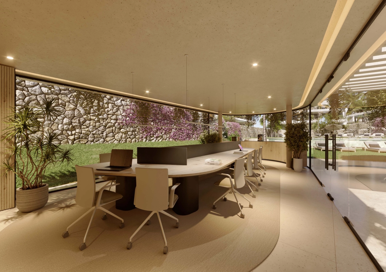 Een serene co-working ruimte met uitzicht op de tuin, die een comfortabele en inspirerende omgeving biedt voor werk of vergaderingen.