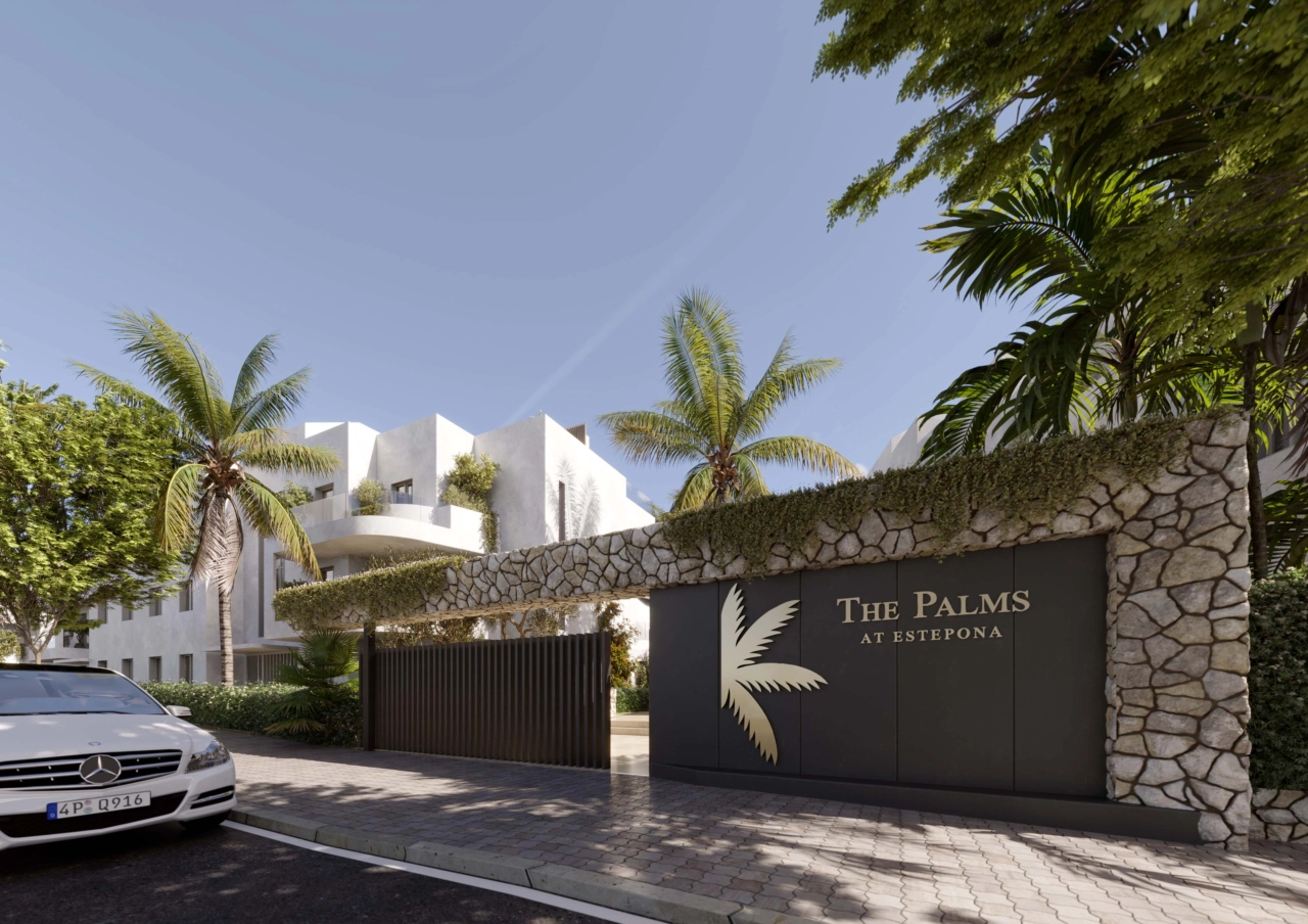De beveiligde, omheinde ingang van The Palms, die privacy en exclusiviteit belooft vanaf het moment van aankomst.