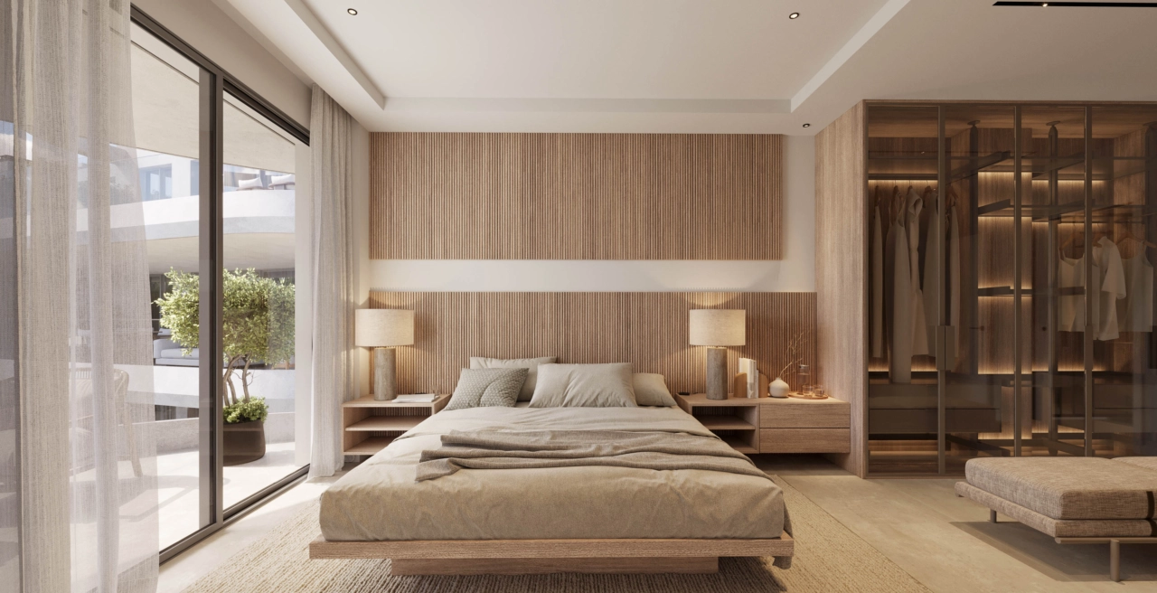 De hoofdslaapkamer biedt een rustig toevluchtsoord, met elegant design, royale kastruimte en directe toegang tot een privéterras.